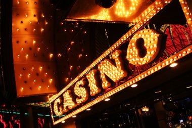 Live Casino dealer at table with multiple camera angles